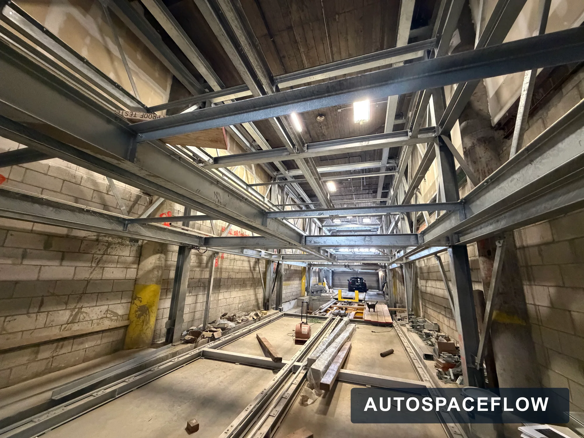 Fully automatic pallet shuttle parking system being installed inside an existing building basement in the United States